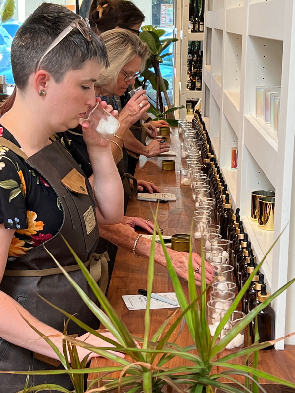 People Selecting fregrances for scent blending at Boho Bungalow Candle Bar