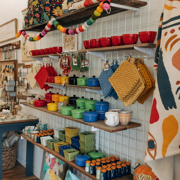 The throw pillow wall at Boho Bungalow Petaluma — the category the boutique is best known for.